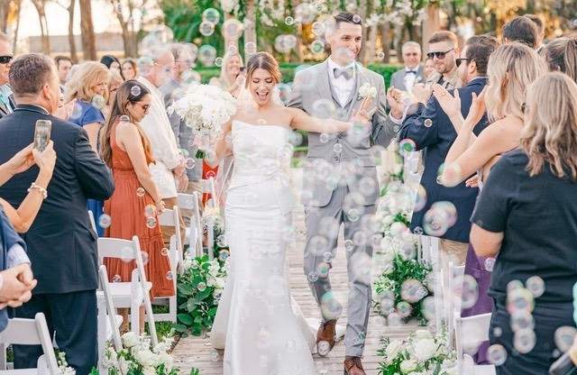 Happily Married Couple Walking Post Ceremony